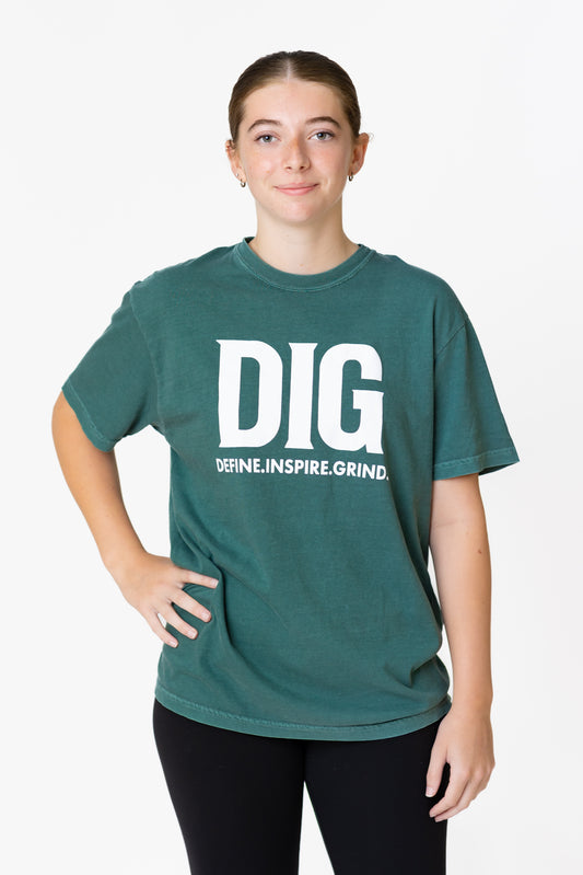 Person wearing a green t-shirt with 'DIG' text on a white background
